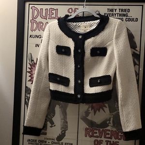 Very cute jacket hits right at the waste or above. Black and white.